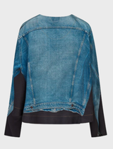 A light blue Cad blouse hanging, featuring a stylish cut and soft fabric, ideal for casual or formal wear.