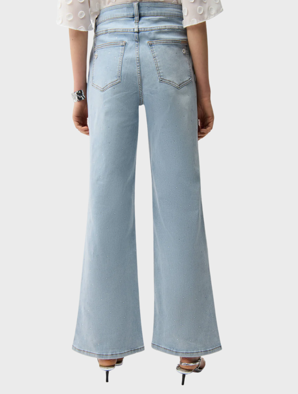 A pair of light blue denim spring pants laid flat, highlighting their casual style and perfect fit for spring outings.