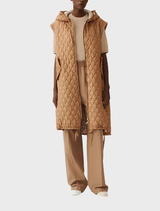 A light brown jacket hanging, showcasing a simple yet elegant style suitable for casual wear.