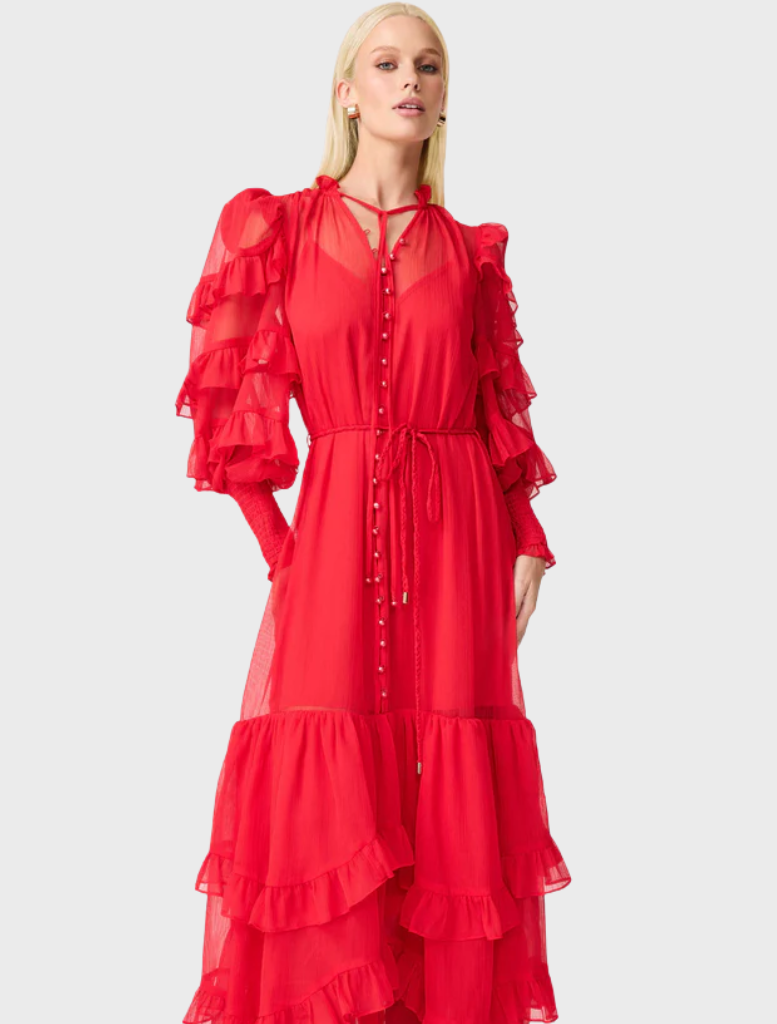 A flowing red dress with ruffled sleeves, designed to create a dramatic and eye-catching silhouette.