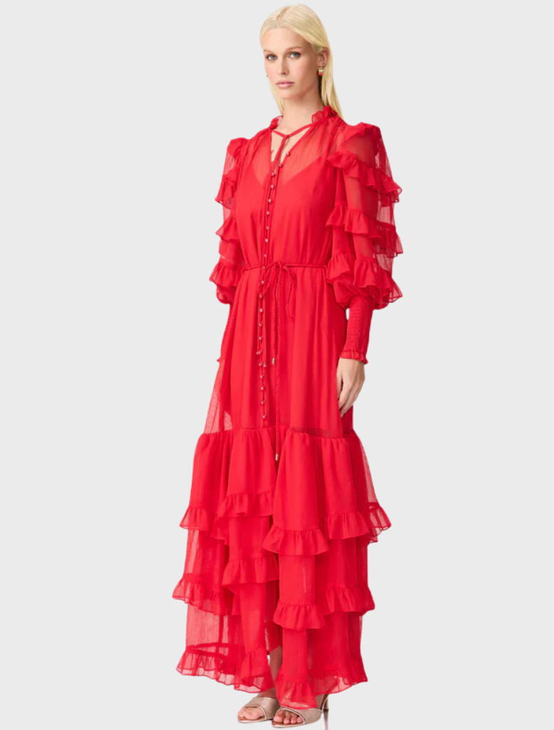  A long red dress adorned with ruffled sleeves, combining elegance and a striking color for a stunning look.