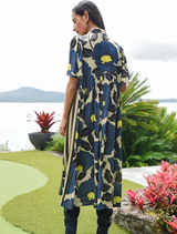 Fluid satin dress in lime and blue floral design, with button front, gathered waist, and modern striped side detailing.