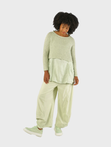 Vibrant lime tank top shown flat, emphasizing its sleeveless design and bright hue against a light background.
