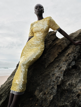 Lime green Kaia Sleeve Dress showcasing a modern silhouette with flowing sleeves, ideal for various events.