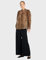 Soft gauze-like linen blouse in bold Wildcat print, designed with gathered front panels and a front yoke for an elevated look.