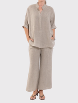 The Lino Villa Overshirt in Stucco showcases a relaxed fit, stand collar, and short dolman sleeves, made from a Japanese linen blend.