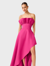 Modern pink orchid gown with a strapless and asymmetric design, highlighting structured details for a chic appearance.