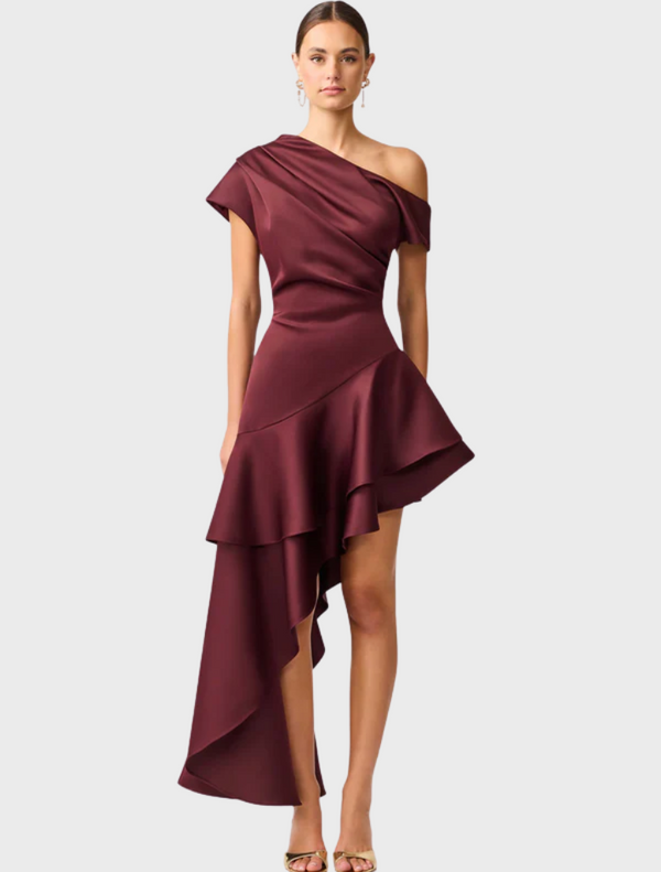 Burgundy satin dress featuring an asymmetric hem, elegantly draping for a stylish silhouette.