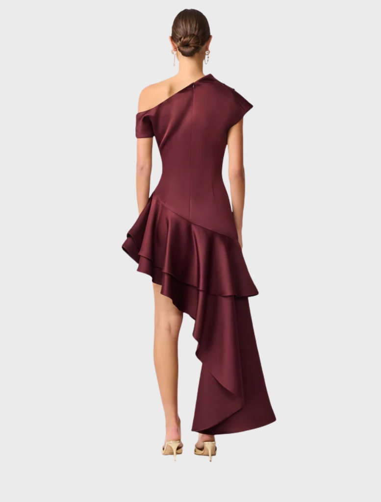 Elegant burgundy dress made of satin, designed with a unique asymmetric hem for a fashionable appearance.