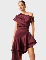 A stylish burgundy satin dress featuring an asymmetric hem, perfect for formal occasions or evening wear.