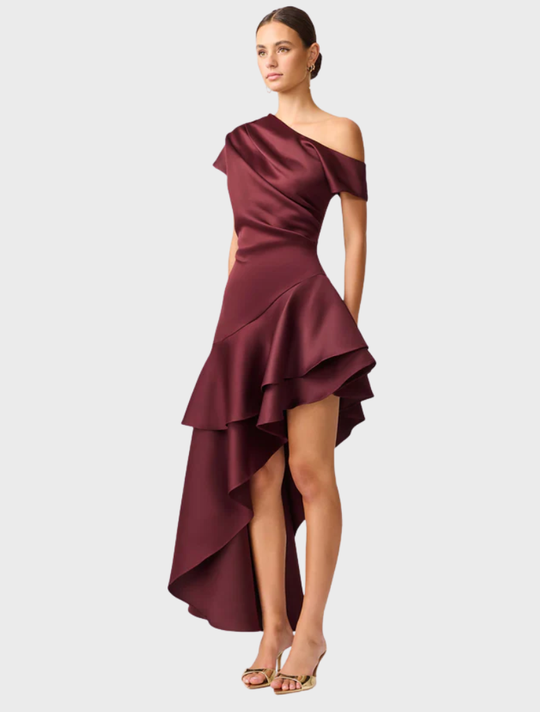 Satin burgundy dress with a striking asymmetric hem, combining sophistication and contemporary style.