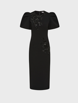 Elegant black midi dress with a fitted bodice and flowing skirt, perfect for formal occasions or evening events.