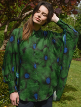 Green floral shirt with the text "Living The Dream" printed prominently on the front.