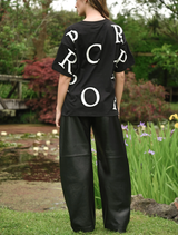 Close-up of black Lock, Stock & Barrel pants, focusing on the fabric and stitching details for a refined look.