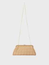 Beige woven clutch bag, labeled Lois Woven Frame Bag - Natural  hanging on a hook.