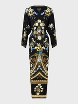 Long split front twist dress in Ottoman style, featuring elegant draping and a sophisticated silhouette.
