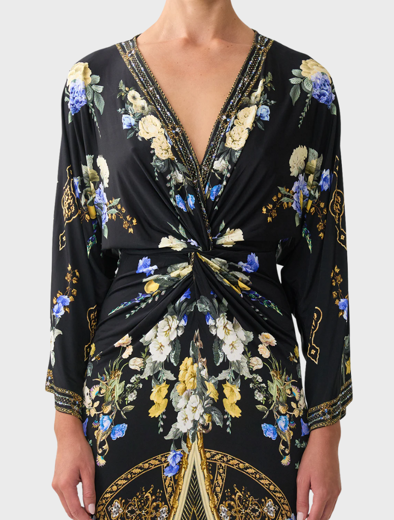 Long twist dress with a split front, embodying Ottoman elegance through its graceful design and flowing fabric.