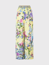 Silk lounge pant with Chinoiserie print, featuring a relaxed silhouette, wide legs, and custom tassel trim for added flair.