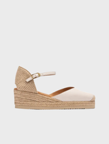 Low wedge espadrille in canelle color, featuring a woven jute sole and a stylish, comfortable design for casual wear.