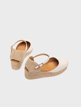 Stylish low wedge espadrille in canelle, designed with a jute sole for comfort and elegance in casual settings.