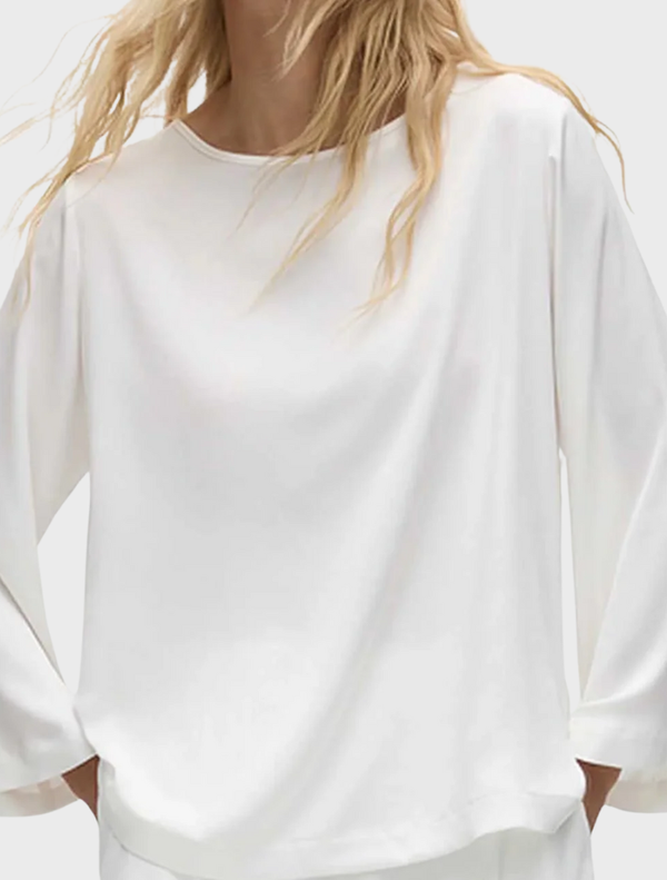 Elegant ivory LS Slice Neck Plaza Top with a unique slice neckline, ideal for a chic and comfortable outfit.