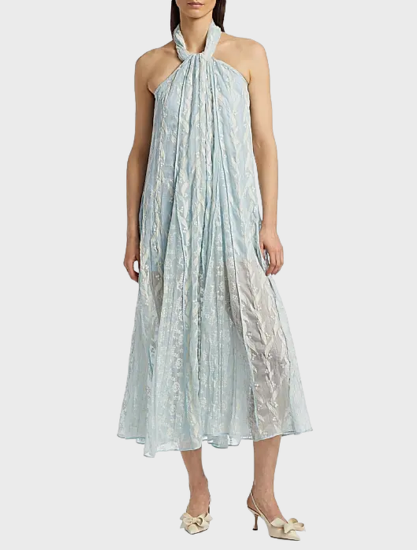 Aqua Luana Dress hanging on a rack, highlighting its vibrant color and stylish, relaxed fit.