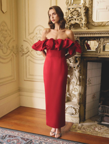Lucetta's red column gown with off-shoulder neckline, showcasing a sophisticated and modern style.