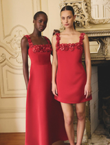 A vibrant red midi dress with a square neckline and flared skirt, highlighting the Lucetta brand's stylish design.