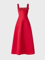 A vibrant red midi dress by Lucetta, designed with a square neck and flared bottom, presented on a mannequin.