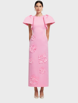  A pink dress featuring a vibrant floral pattern, showcasing a blend of colors and intricate designs.
