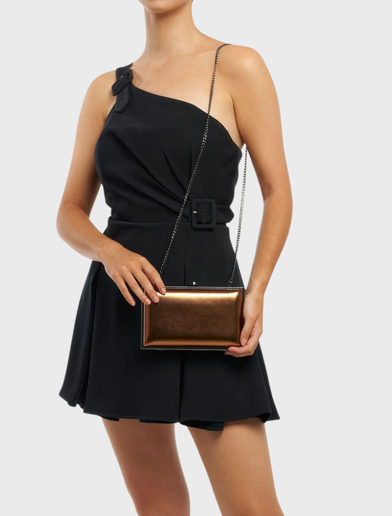  Elegant clutch bag in shiny metal, featuring a smooth, reflective finish that enhances its modern appeal.