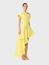 One-shoulder yellow gown with ruffle detailing, designed for a graceful and fashionable appearance.