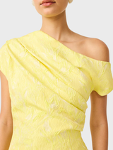 Chic yellow one-shoulder gown with ruffle embellishments, offering a modern and elegant appearance.