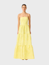 A yellow strapless gown with a fitted bodice and flowing skirt, perfect for formal occasions.