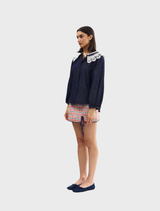 Stylish indigo denim blouse with lace embellishments, combining comfort and sophistication for versatile wear.
