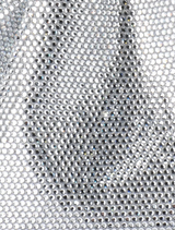A fashionable silver purse with a distinctive metal handle.
