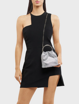 A chic silver purse equipped with a sturdy metal handle, combining fashion and practicality in one accessory.