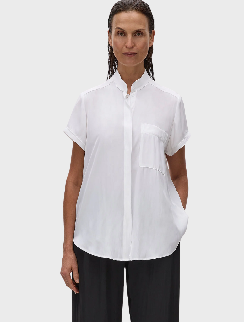Mache Stand Shirt in white, elegantly hanging, highlighting its stand collar and tailored fit.