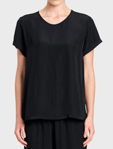 Black Travel T by Mela Purdie, featuring a scooped neckline and short sleeves, ideal for layering and everyday wear.