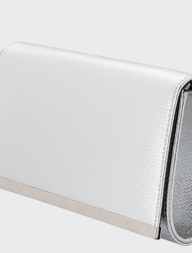 Silver wallet with embossed detailing and a metal clasp, identified as Maddie Metallic Embossed Foldover.
