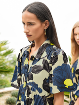Elegant lime and blue floral dress made of satin, showcasing a button-through front, gathered waist, and striped panels.