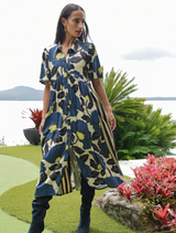 Lime and blue floral dress with satin fabric, button front, gathered waist, and striped side panels for a modern look.