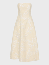 Champagne-colored Madelein dress with a flowing silhouette and elegant design, perfect for formal occasions.