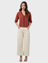 Luxurious sandalwood cardigan made of cotton-cashmere, featuring lurex details for a refined, elegant look.
