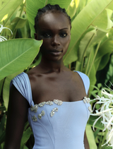 Malia Gown in blue, featuring a flowing silhouette and elegant design, perfect for formal occasions.