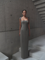 Elegant Malia gown in smoke color, featuring a flowing silhouette and delicate fabric for a sophisticated look.
