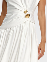 A stylish ivory maxi dress from Mannersly, designed for comfort and elegance at formal gatherings.