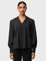 Black stretch shirt by Marcela Pearl, adorned with embellishments for a chic and modern appearance.