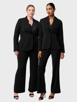 Elegant black blazer by Marcela Pearl, adorned with embellishments, perfect for formal or stylish occasions.