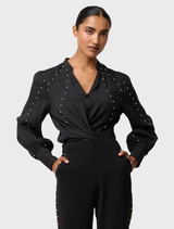 Marcela Pearl's black cupro stretch shirt, showcasing intricate embellishments for a fashionable touch.